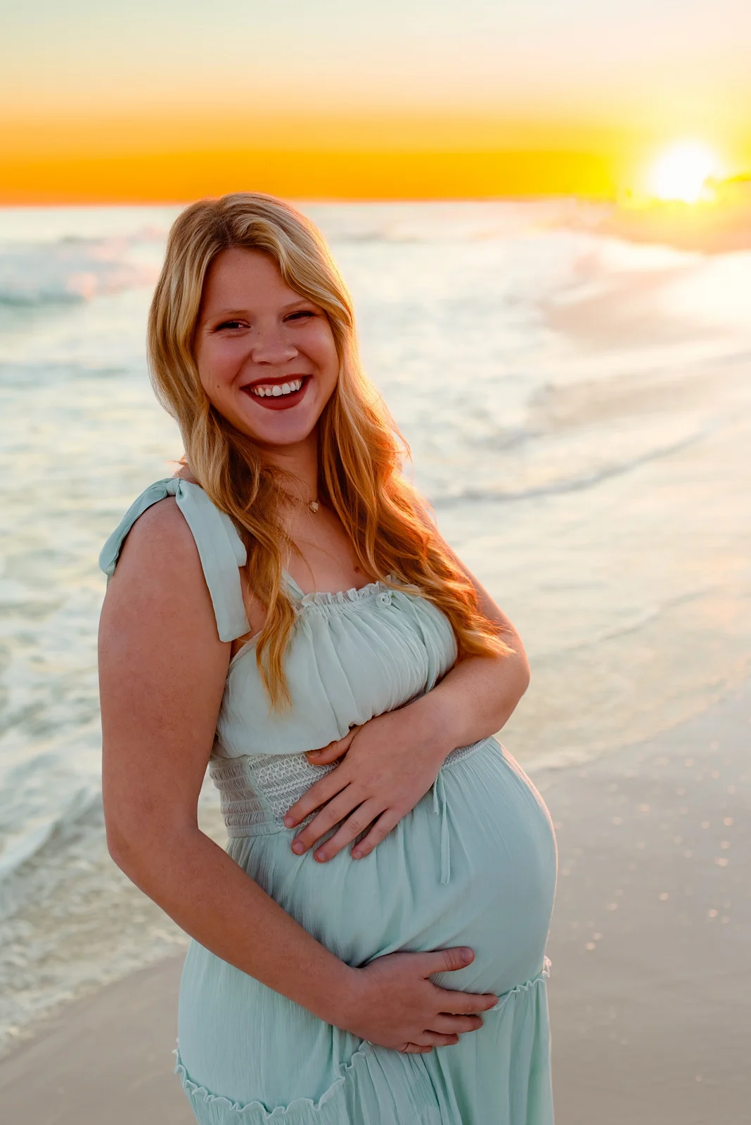 Warm sunset maternity portrait on Pensacola Beach
