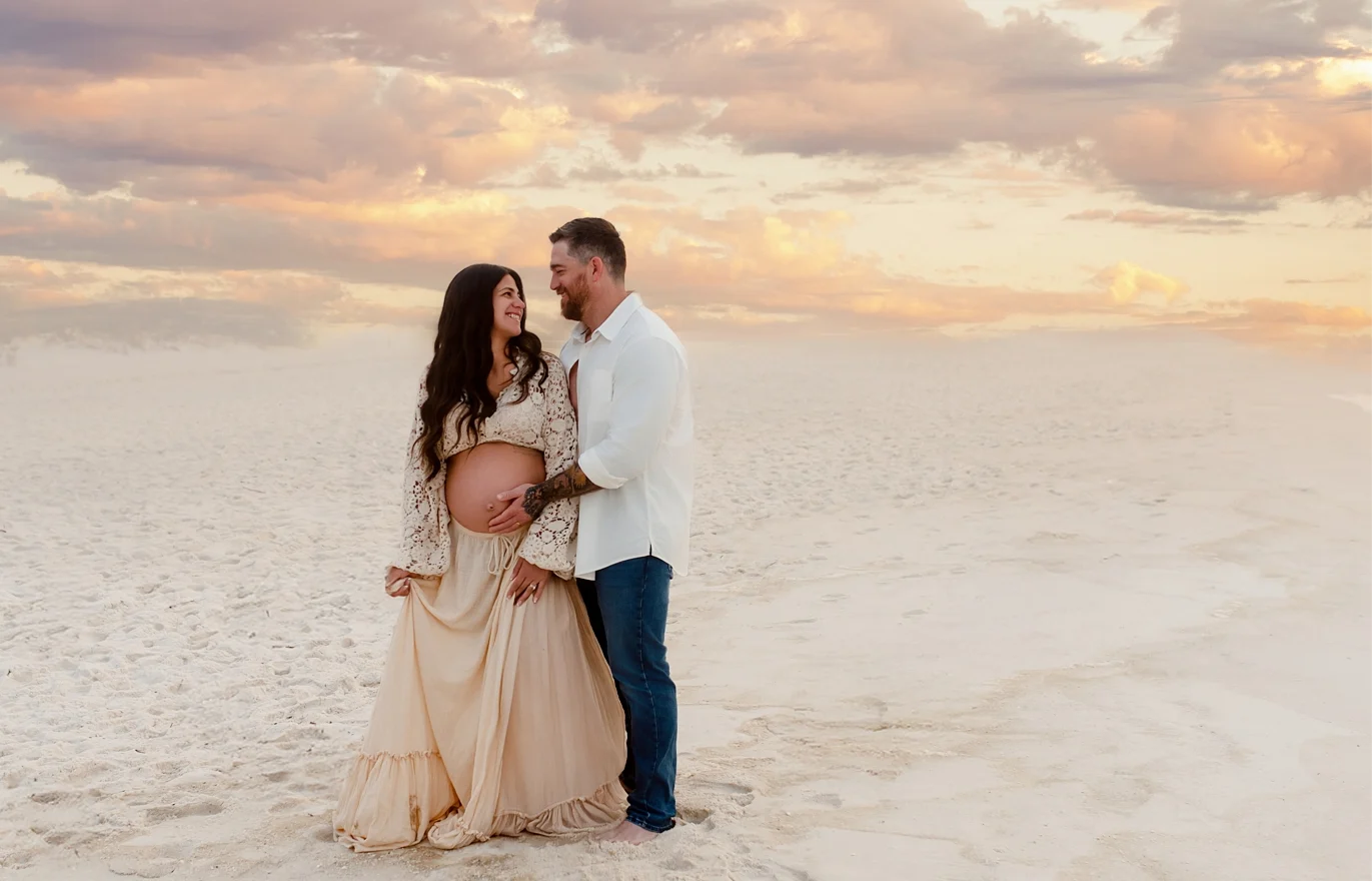 Expecting couple on Pensacola Beach at sunset