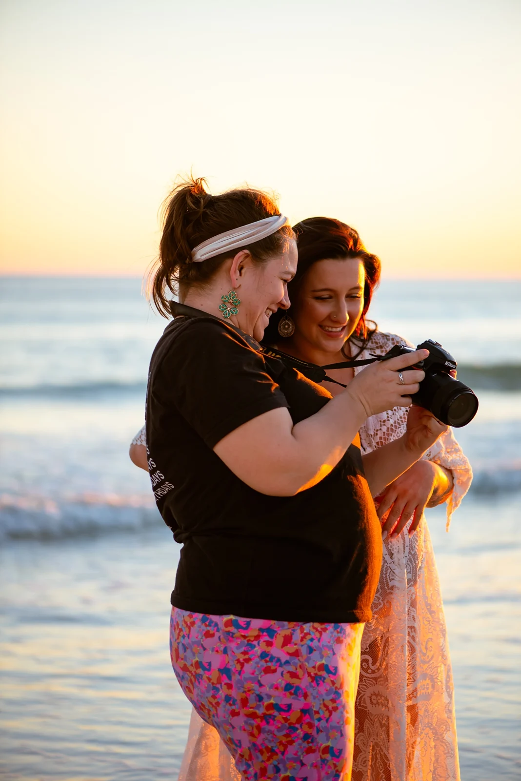 Shanna-Kaye photographing an expecting mother on Pensacola Beach