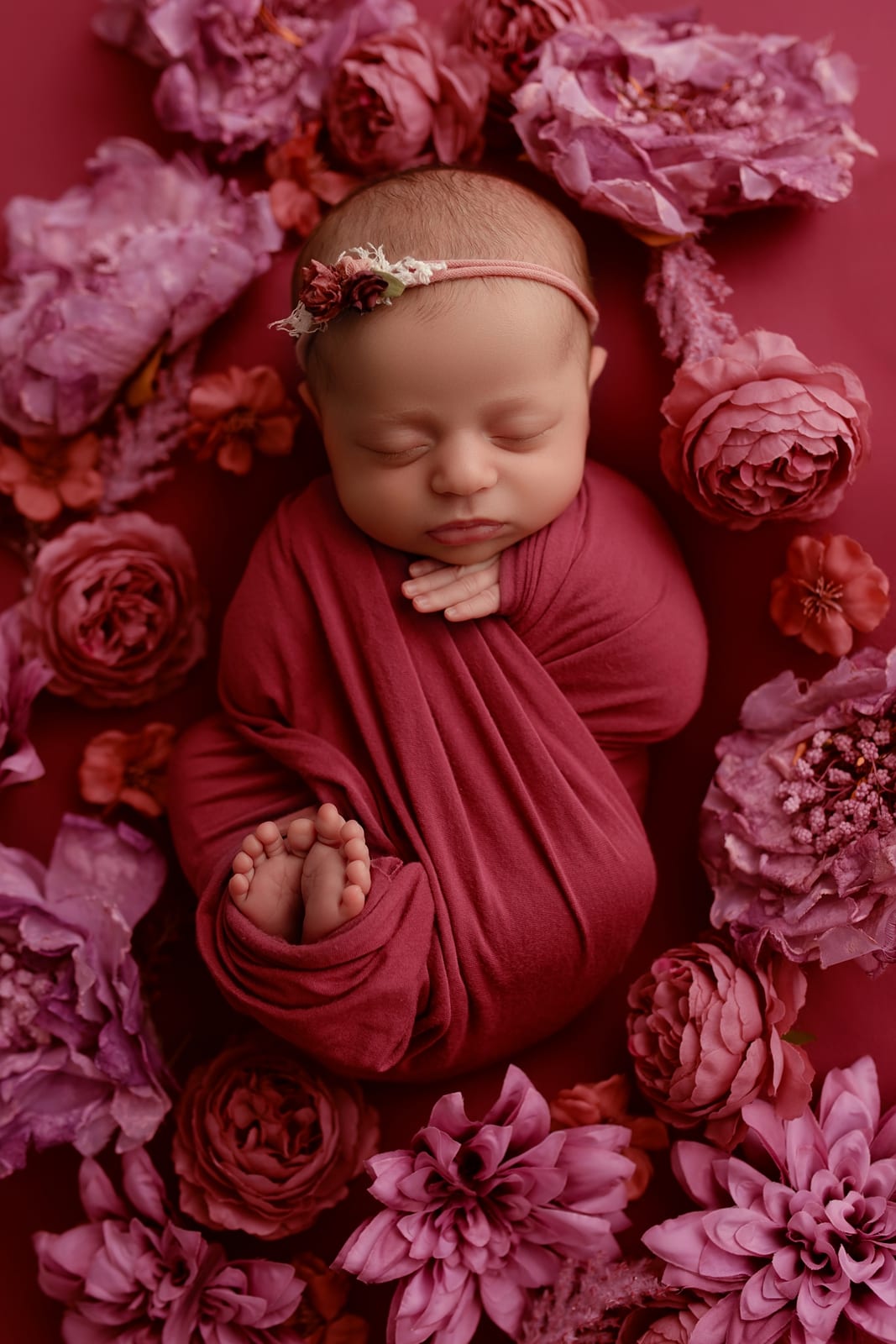Newborn in magenta wrap