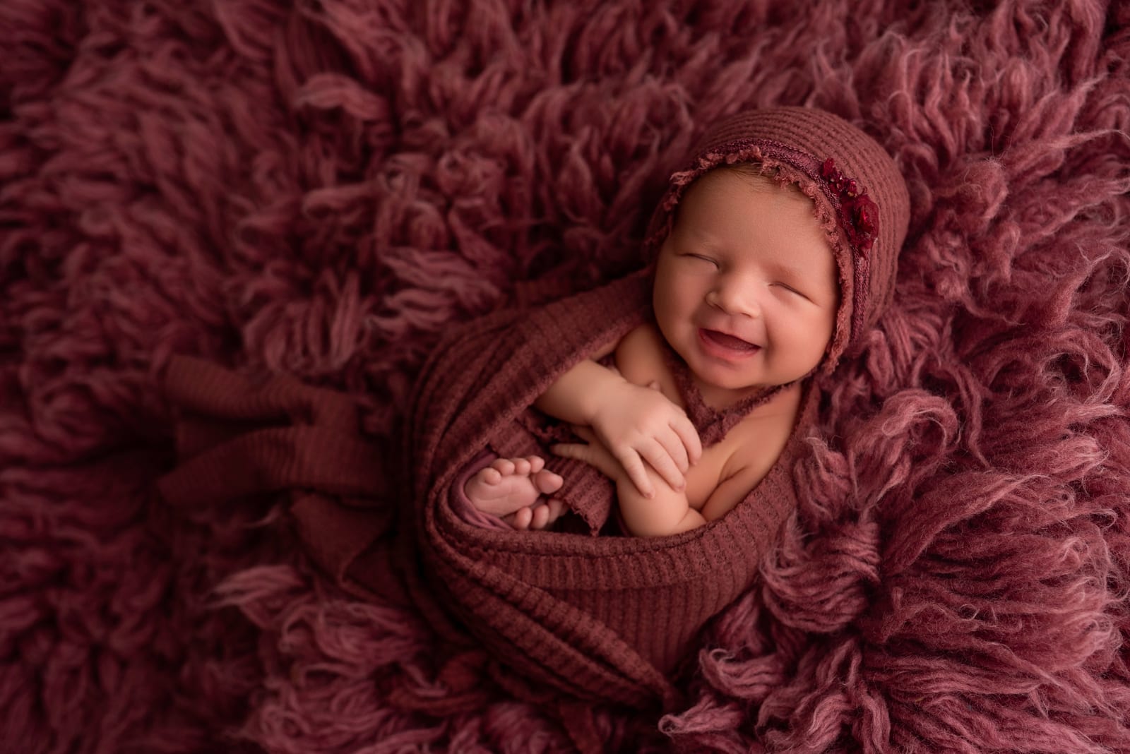 Newborn on rose texture